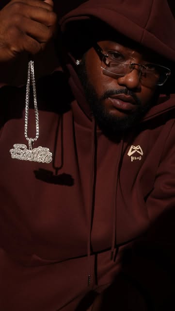 Iced chain worn over a HHUE hoodie